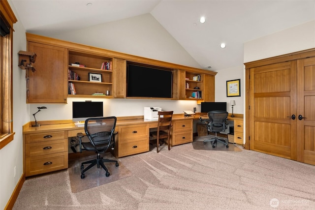 office area with light colored carpet, recessed lighting, built in desk, lofted ceiling, and baseboards