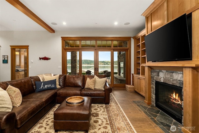 living room featuring wood finished floors, a fireplace, beam ceiling, and recessed lighting