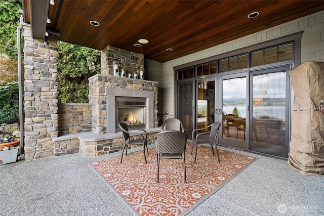 view of patio / terrace with an outdoor stone fireplace
