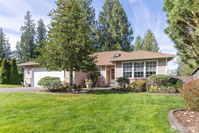 ranch-style house with an attached garage, aphalt driveway, and a front lawn