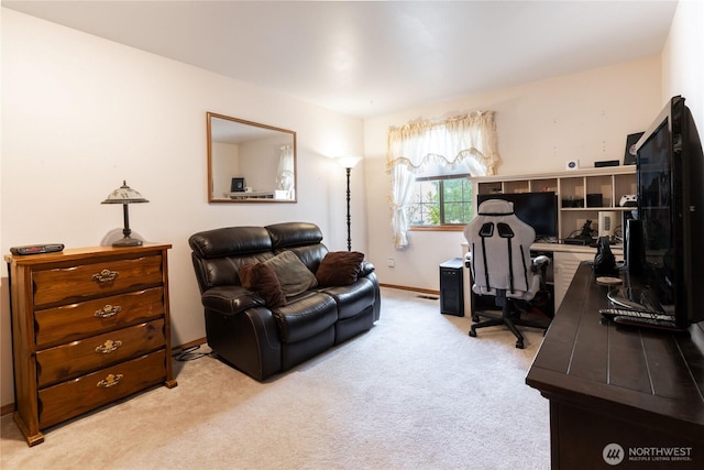 carpeted office featuring baseboards