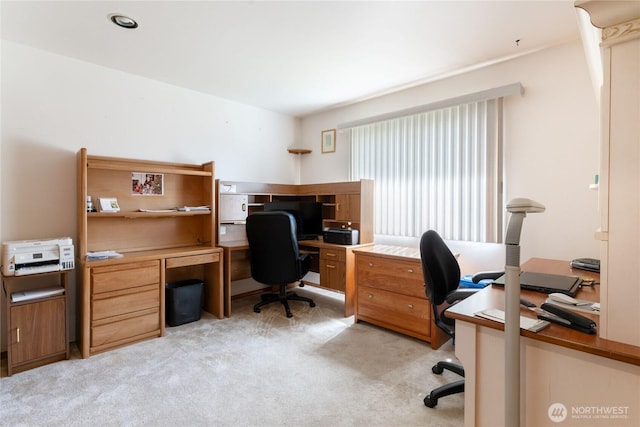 office space with light colored carpet