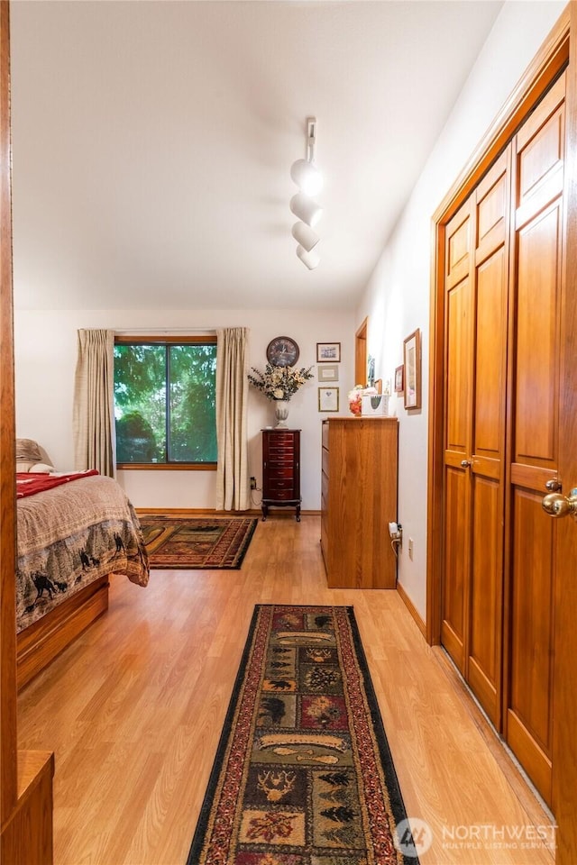 bedroom featuring light wood-style flooring