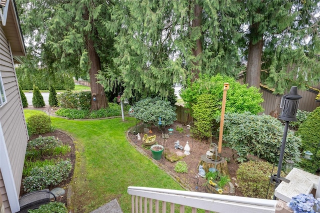view of yard with a garden and fence