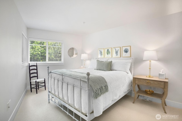 bedroom featuring carpet floors and baseboards