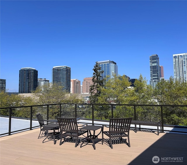 wooden terrace with a city view