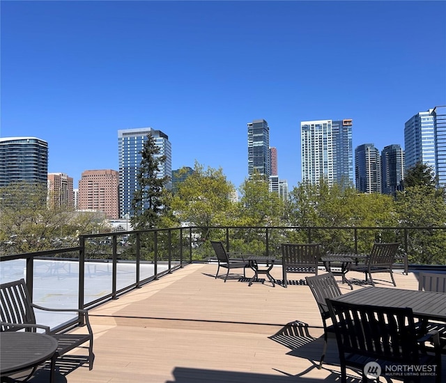 wooden deck with a city view