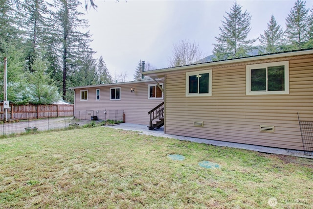 8095 Mosey Ct, Maple Falls, WA 98266 - rear view of house featuring a patio area, fence, and a lawn