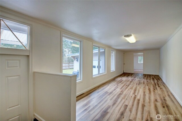 8095 Mosey Ct, Maple Falls, WA 98266 - interior space with crown molding, baseboards, and light wood finished floors