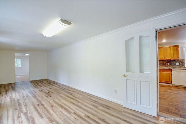 8095 Mosey Ct, Maple Falls, WA 98266 - empty room featuring ornamental molding, baseboards, and light wood-style floors