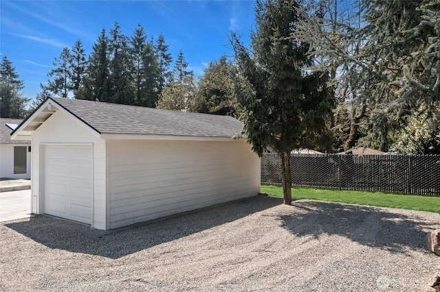 detached garage with fence