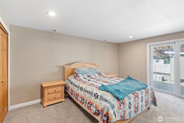 bedroom featuring access to exterior, light colored carpet, baseboards, and recessed lighting