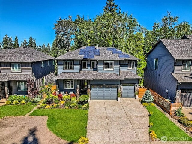 16216 81st Pl NE, Kenmore, WA 98028 - view of front of house featuring concrete driveway, solar panels, roof with shingles, and an attached garage