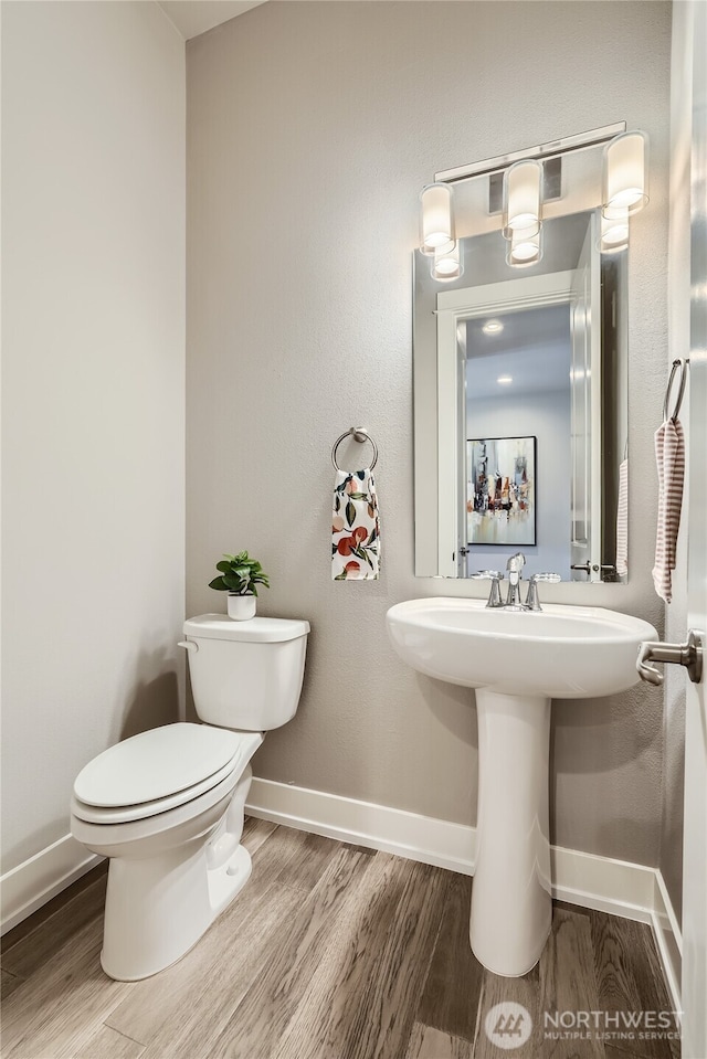 16216 81st Pl NE, Kenmore, WA 98028 - half bath with wood finished floors, toilet, and baseboards