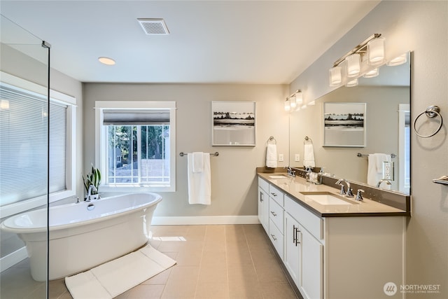 16216 81st Pl NE, Kenmore, WA 98028 - full bathroom with double vanity, baseboards, and a freestanding tub