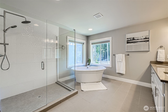 16216 81st Pl NE, Kenmore, WA 98028 - bathroom with a shower stall, a soaking tub, vanity, baseboards, and tile patterned floors