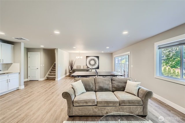 16216 81st Pl NE, Kenmore, WA 98028 - living room with stairs, light wood-style flooring, a chandelier, recessed lighting, and baseboards