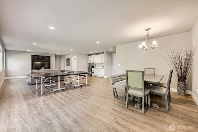 16216 81st Pl NE, Kenmore, WA 98028 - dining area featuring baseboards, a chandelier, light wood-style floors, and recessed lighting