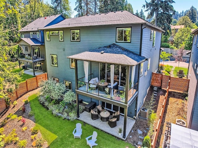 16216 81st Pl NE, Kenmore, WA 98028 - back of property with a patio area, a shingled roof, an outdoor fire pit, a garden, and central air condition unit