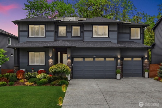 16216 81st Pl NE, Kenmore, WA 98028 - prairie-style home featuring an attached garage, driveway, board and batten siding, a yard, and roof with shingles