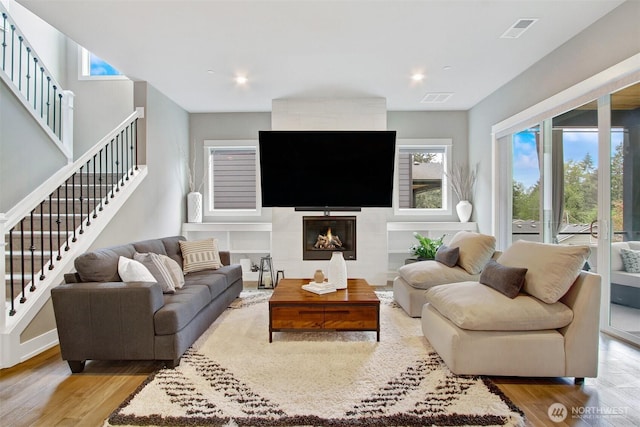 16216 81st Pl NE, Kenmore, WA 98028 - living room with wood finished floors, healthy amount of natural light, stairs, and recessed lighting