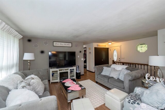 9365 Central Valley Rd NE, Bremerton, WA 98311 - living area with a wealth of natural light, visible vents, and wood finished floors