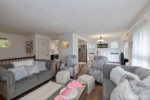 9365 Central Valley Rd NE, Bremerton, WA 98311 - living area with wood finished floors and a notable chandelier