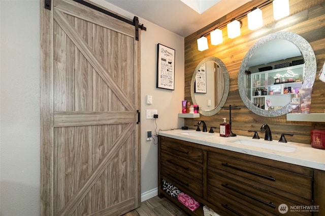 9365 Central Valley Rd NE, Bremerton, WA 98311 - full bathroom featuring a sink, baseboards, double vanity, and wood finished floors