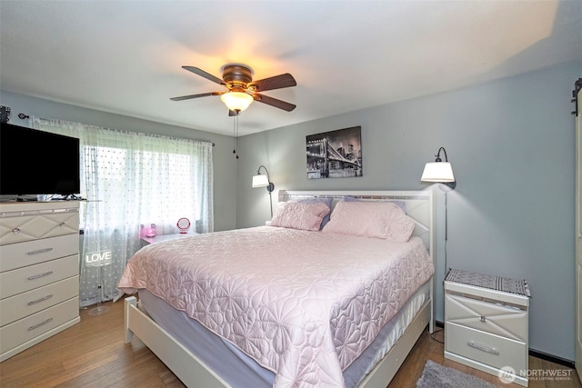 9365 Central Valley Rd NE, Bremerton, WA 98311 - bedroom with wood finished floors and ceiling fan