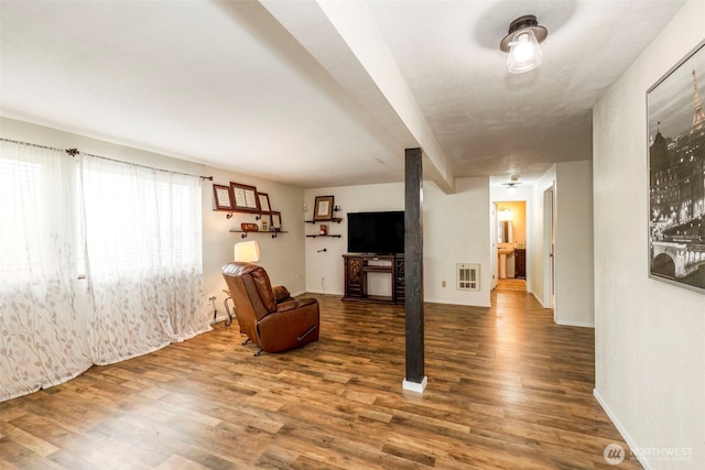 9365 Central Valley Rd NE, Bremerton, WA 98311 - sitting room with baseboards, heating unit, and wood finished floors