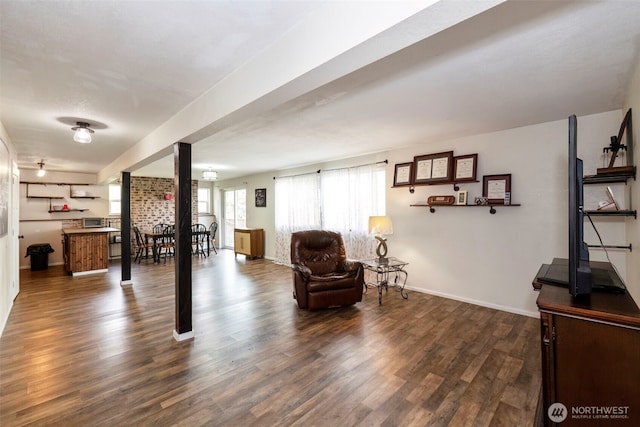 9365 Central Valley Rd NE, Bremerton, WA 98311 - living area with dark wood-style flooring and baseboards