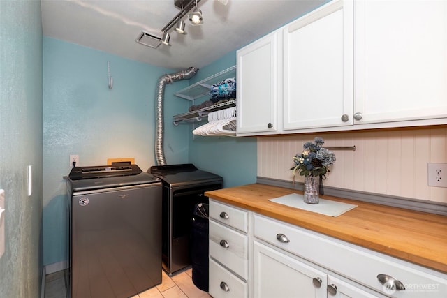 9365 Central Valley Rd NE, Bremerton, WA 98311 - laundry area featuring separate washer and dryer and cabinet space