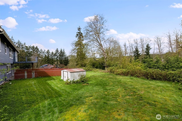 9365 Central Valley Rd NE, Bremerton, WA 98311 - view of yard with an outbuilding, fence, and a storage unit