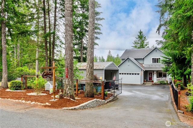 1921 NE Haven Way, Tahuya, WA 98588 - traditional-style home featuring aphalt driveway, fence, and covered porch