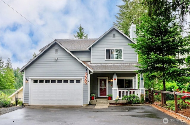 1921 NE Haven Way, Tahuya, WA 98588 - view of front of property with a porch, fence, a shingled roof, and driveway