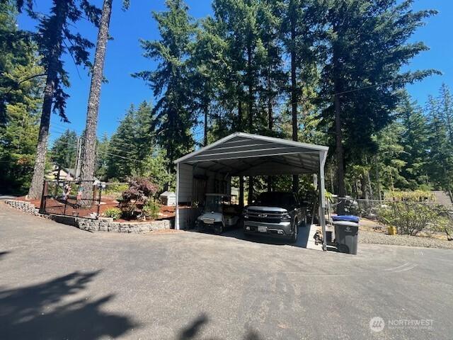 1921 NE Haven Way, Tahuya, WA 98588 - view of parking / parking lot with a detached carport and aphalt driveway