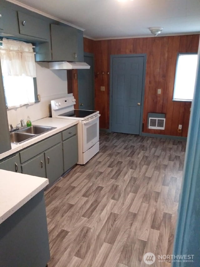 3025 Simpson Ave, Hoquiam, WA 98550 - kitchen featuring light countertops, visible vents, white electric range oven, light wood finished floors, and a sink