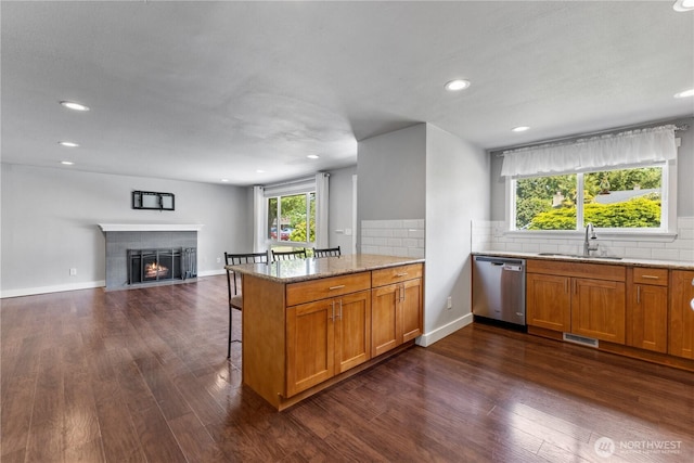 22115 103rd Pl SE, Kent, WA 98031 - kitchen featuring stainless steel dishwasher, dark wood-type flooring, brown cabinetry, and recessed lighting