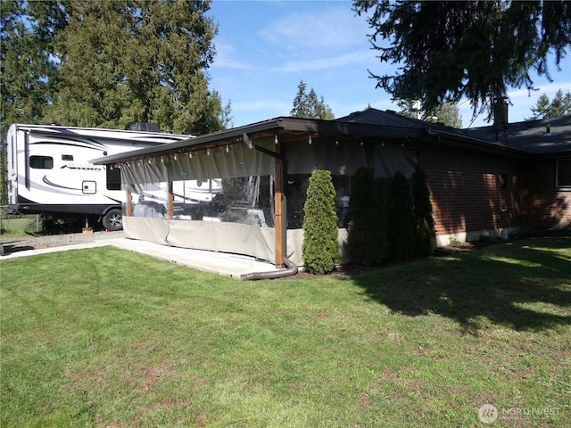 22115 103rd Pl SE, Kent, WA 98031 - view of side of home featuring a lawn and a sunroom