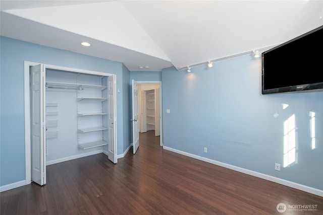 14026 SE 238th Ln, Kent, WA 98042 - unfurnished bedroom featuring lofted ceiling, baseboards, wood finished floors, and a closet