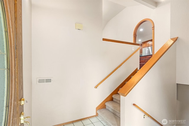 stairs with visible vents and tile patterned floors