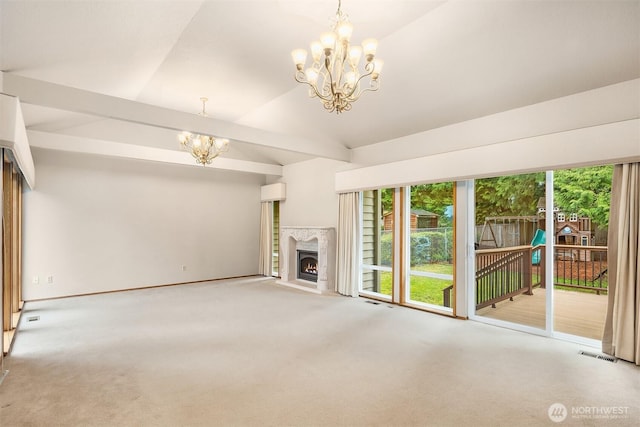 unfurnished living room with visible vents, an inviting chandelier, lofted ceiling with beams, carpet floors, and a lit fireplace