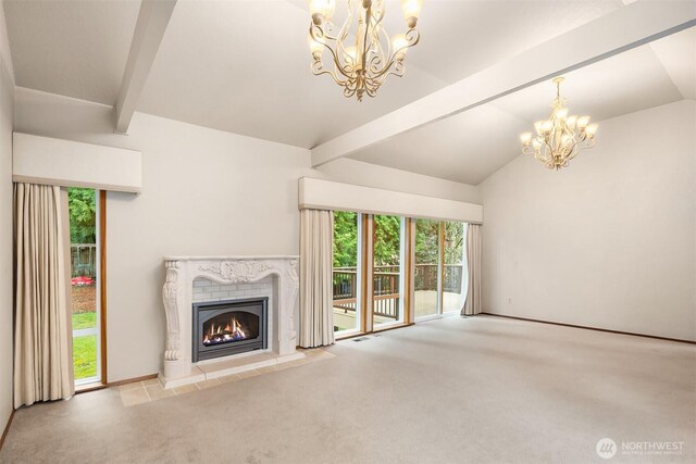unfurnished living room featuring carpet floors, vaulted ceiling with beams, an inviting chandelier, and a high end fireplace