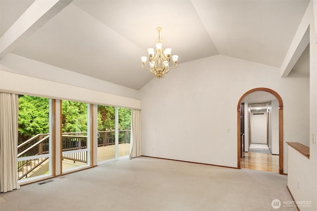 unfurnished room featuring vaulted ceiling, a chandelier, carpet floors, visible vents, and arched walkways