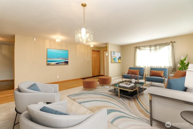 living room featuring wood finished floors and a notable chandelier