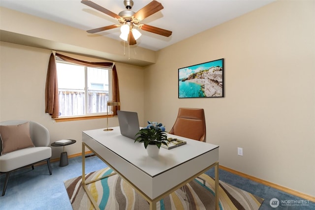 office area with baseboards, ceiling fan, and carpet floors