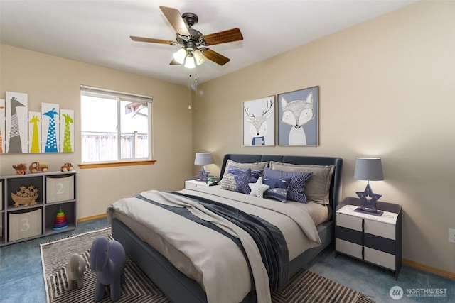 carpeted bedroom with baseboards and ceiling fan
