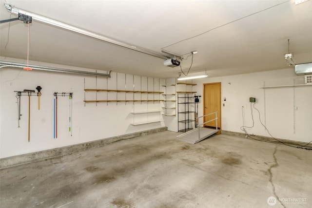 garage featuring a garage door opener