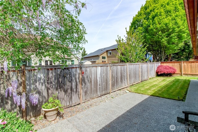 exterior space featuring a fenced backyard and a patio area