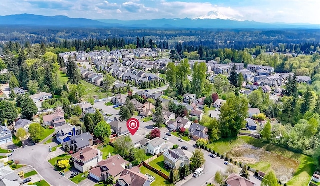 bird's eye view with a residential view, a mountain view, and a forest view